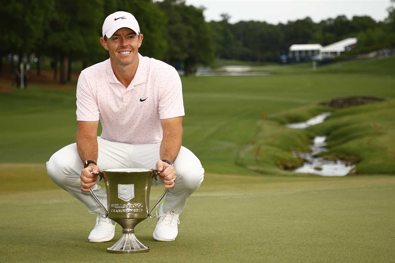 CHARLOTTE, NORTH CAROLINA - MAY 09: Rory McIlroy of Northern Ireland celebrates with the trophy after winning during the final round of the 2021 Wells Fargo Championship at Quail Hollow Club on May 09, 2021 in Charlotte, North Carolina. (Photo by Jared C. Tilton/Getty Images)