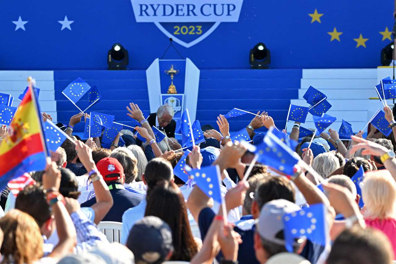 Team Europe fans wave flags as they attend the opening ceremony for of the 44th Ryder Cup at the Marco Simone Golf and Country Club in Rome on September 28, 2023. (Photo by Andreas SOLARO / AFP) (Photo by ANDREAS SOLARO/AFP via Getty Images)