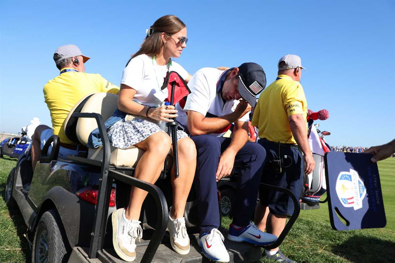 ROME, ITALY - SEPTEMBER 30: Scottie Scheffler of Team United States is consoled by his Wife, Meredith Scheffler after losing his match to Viktor Hovland and Ludvig Aberg of Team Europe (not pictured) 9&7 during the Saturday morning foursomes matches of the 2023 Ryder Cup at Marco Simone Golf Club on September 30, 2023 in Rome, Italy. (Photo by Jamie Squire/Getty Images)