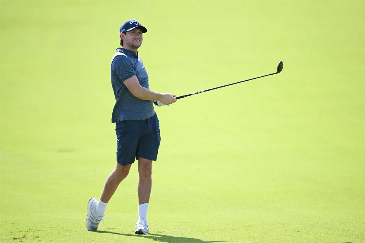 DUBAI, UNITED ARAB EMIRATES - JANUARY 17: Singer-songwriter, Niall Horan plays a shot on the 12th hole during the Pro-Am prior to the Hero Dubai Desert Classic at Emirates Golf Club on January 17, 2024 in Dubai, United Arab Emirates. (Photo by Ross Kinnaird/Getty Images)