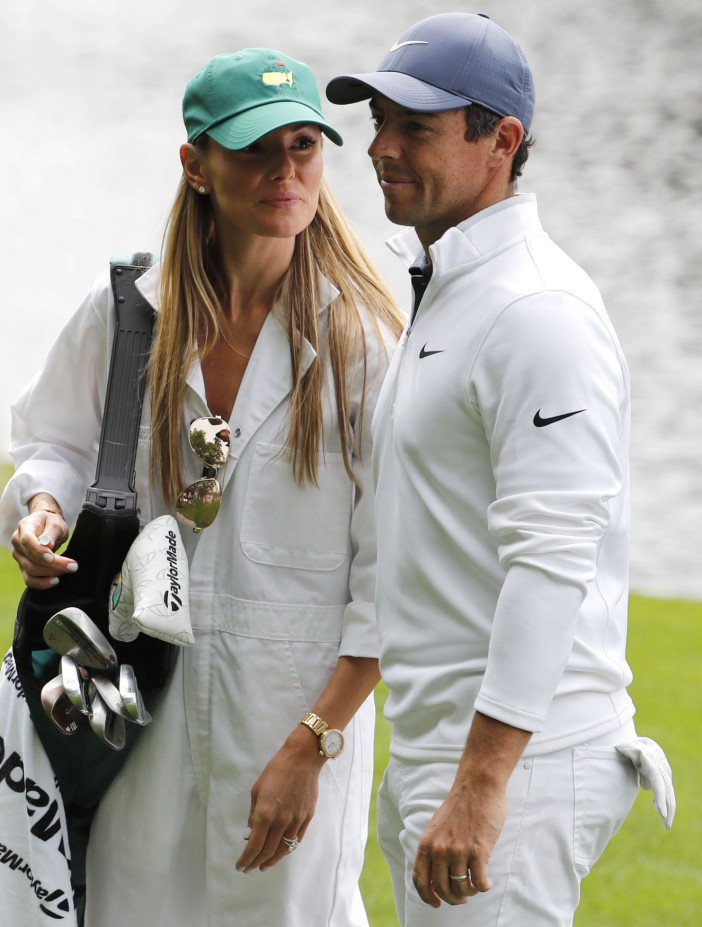 Rory McIlroy of Northern Ireland walks with his wife Erica Stoll during the par 3 contest held on the final day of practice for the 2018 Masters golf tournament at Augusta National Golf Club in Augusta, Georgia, U.S. April 4, 2018. REUTERS/Jonathan Ernst