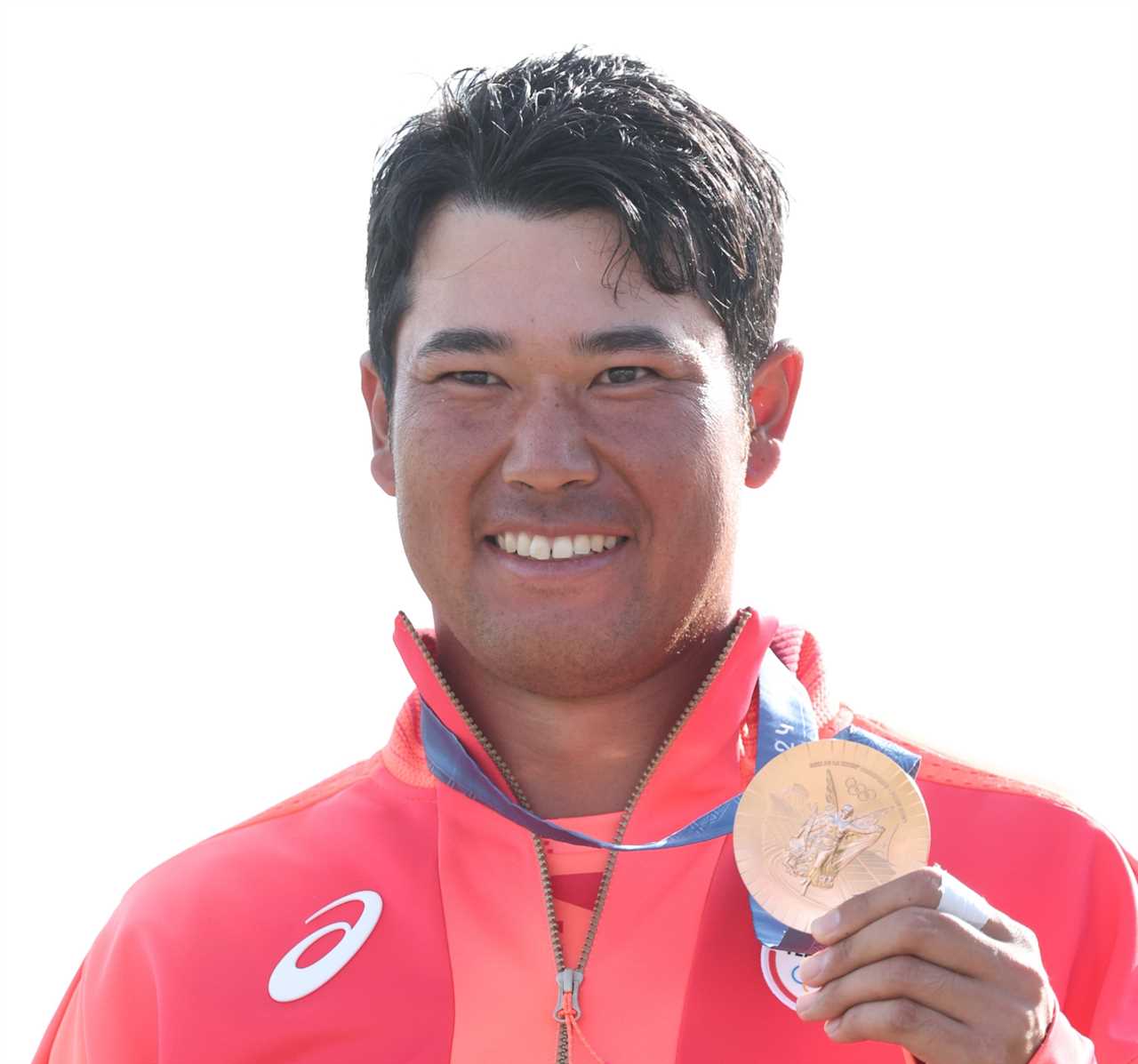 a man wearing an asics jacket is holding a gold medal