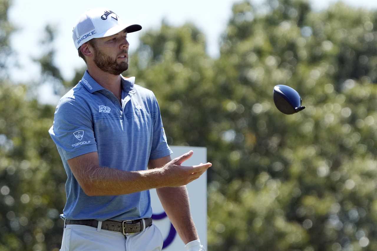 a golfer wearing a shirt that says ford golf