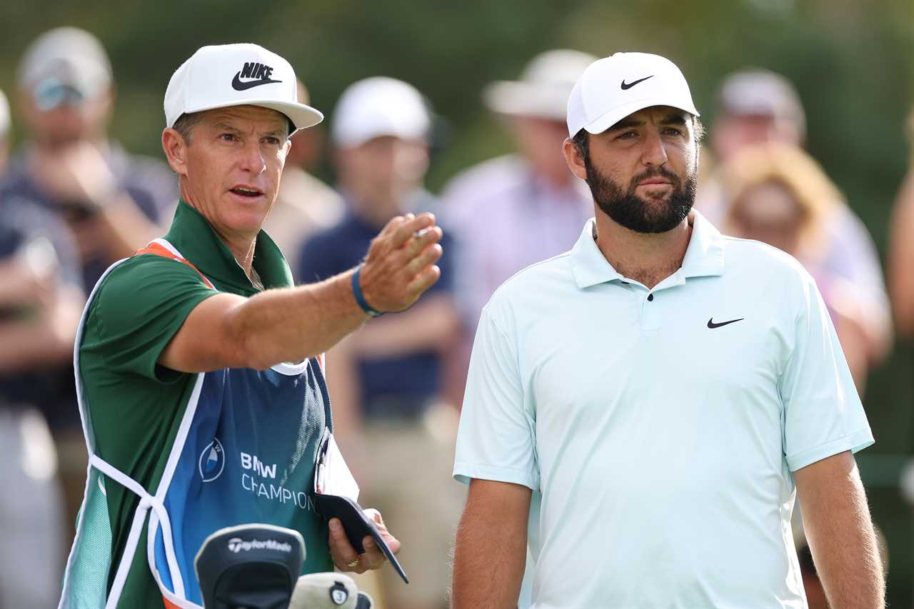 a man wearing a nike hat talks to another man