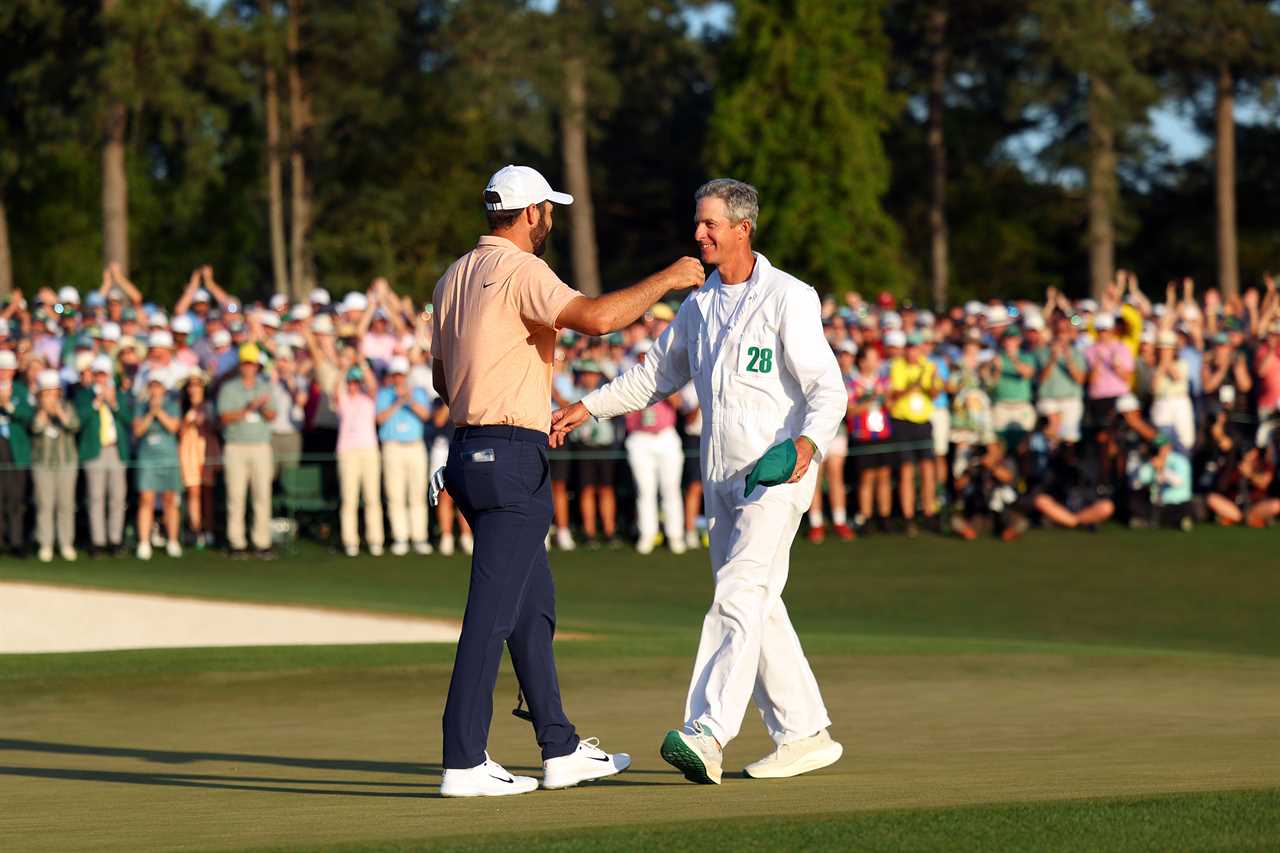 a man with the number 28 on his shirt shakes hands with another man