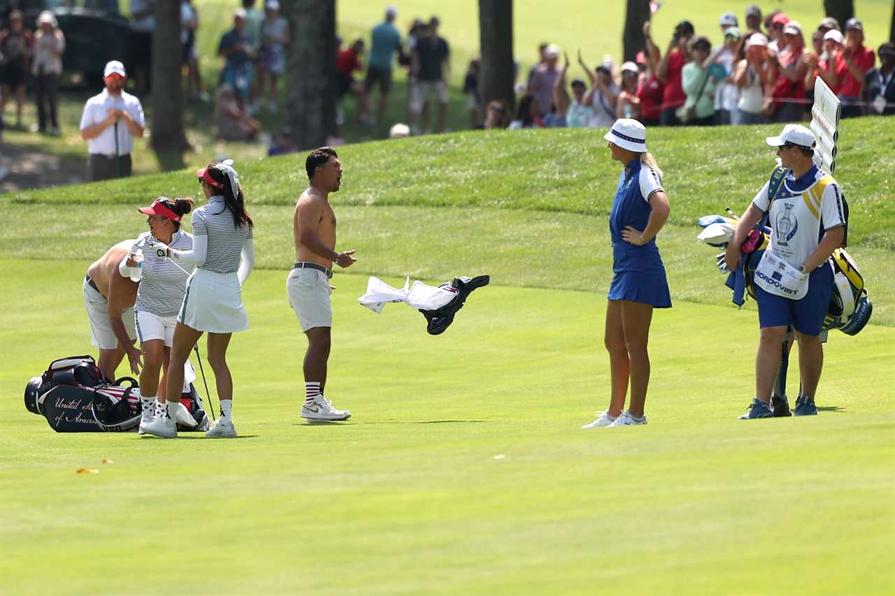 a group of people on a golf course with a bag that says mick jagger on it