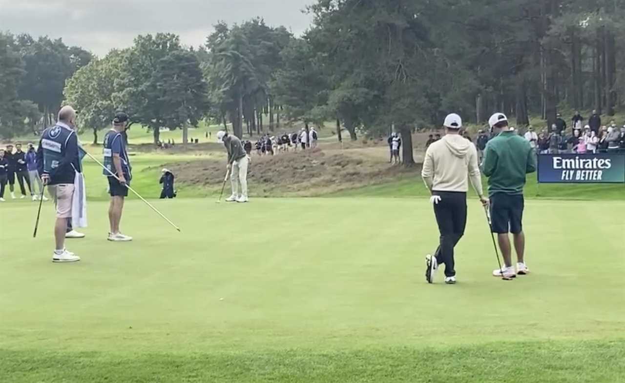 a golf course with a sign that says emirates fly better