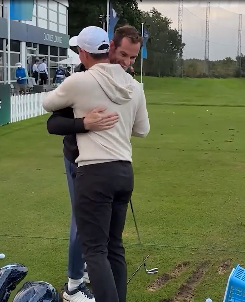 two men hugging on a golf course with the caption how 's things