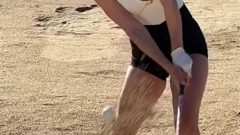 Paige Spiranac risks wardrobe malfunction with ‘provocative’ slo-mo swing video in extremely low-cut top