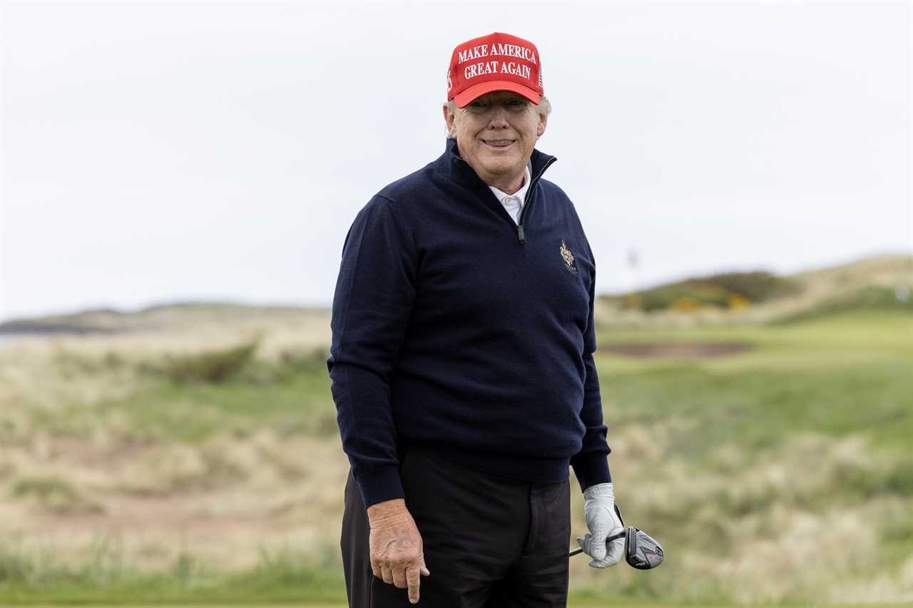 a man wearing a red hat that says make america great again