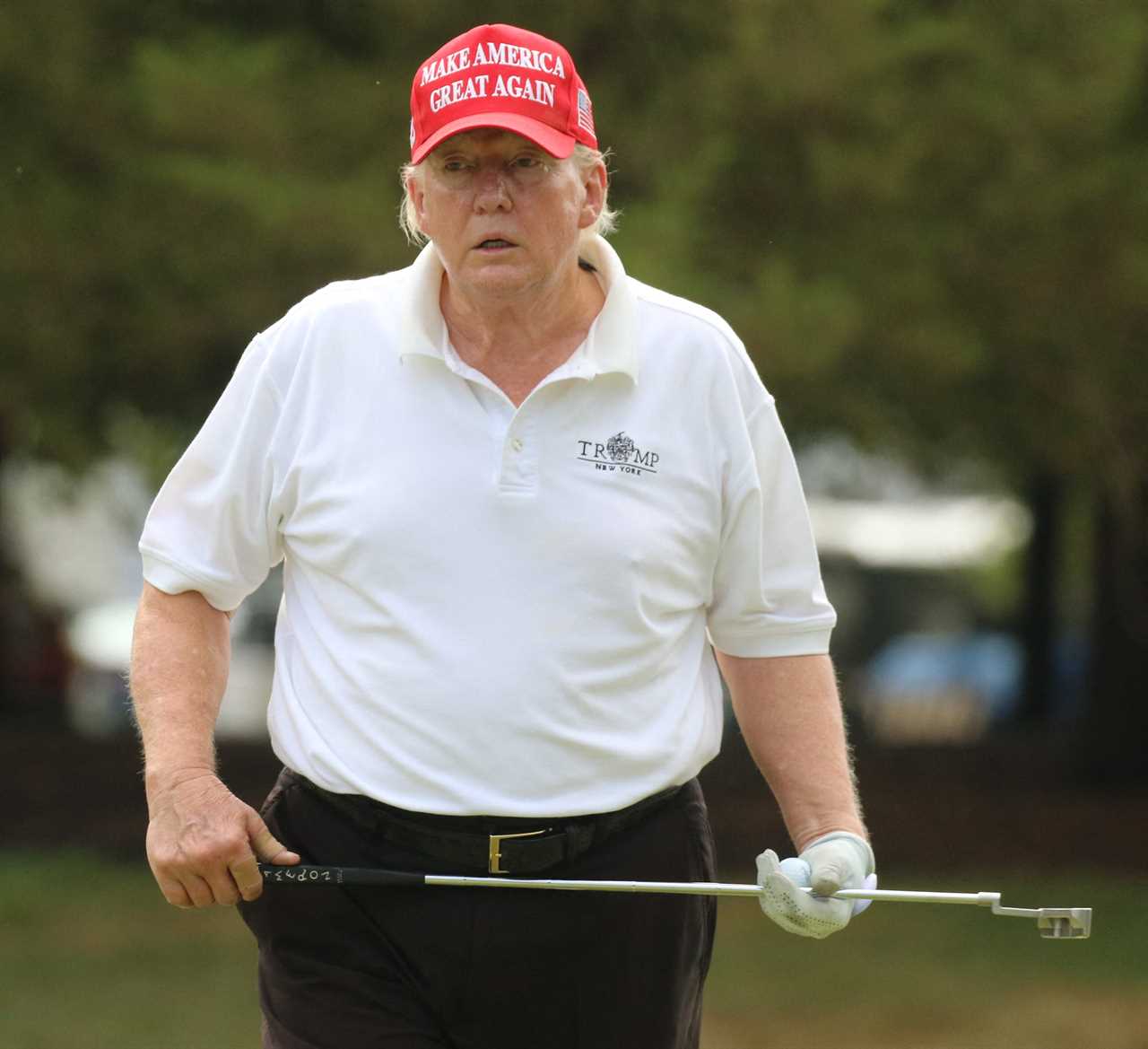 a man wearing a red hat that says make america great again