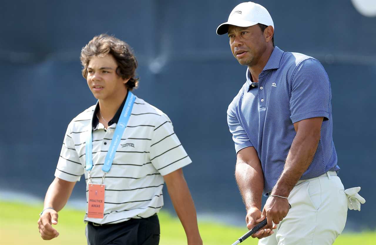 tiger woods and his son walking on a golf course