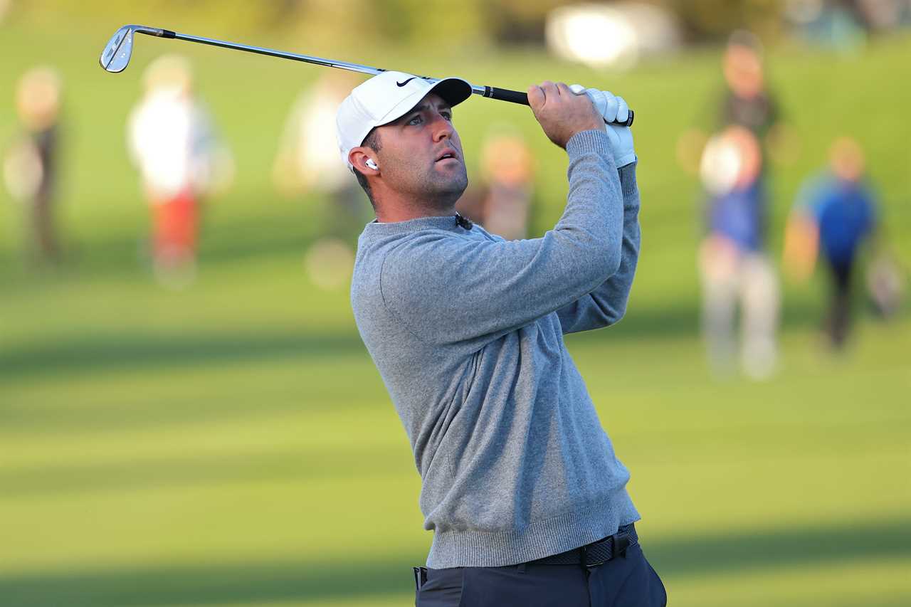 Scottie Scheffler taking a shot during a golf tournament.