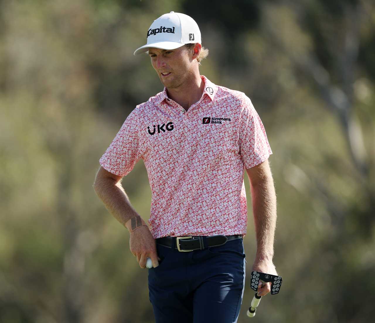 Will Zalatoris walking on the 18th green.