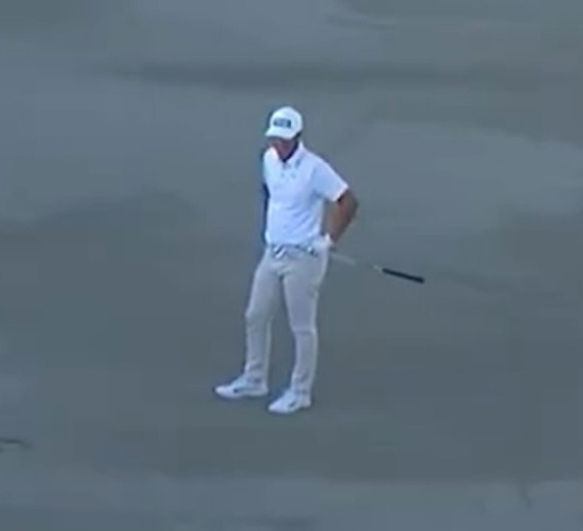 Golfer in a sand trap.