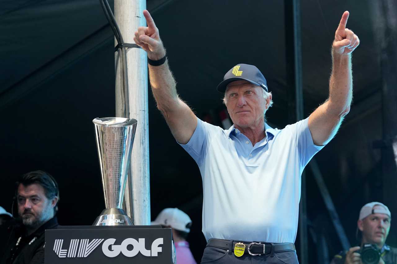 Greg Norman, CEO of LIV Golf, celebrates with arms raised.