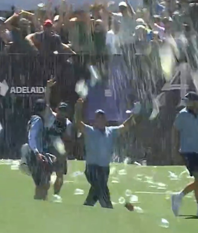 Patrick Reed celebrating a hole-in-one.