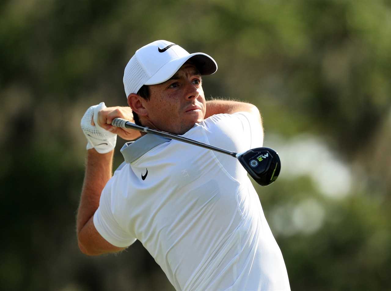 Rory McIlroy playing golf.