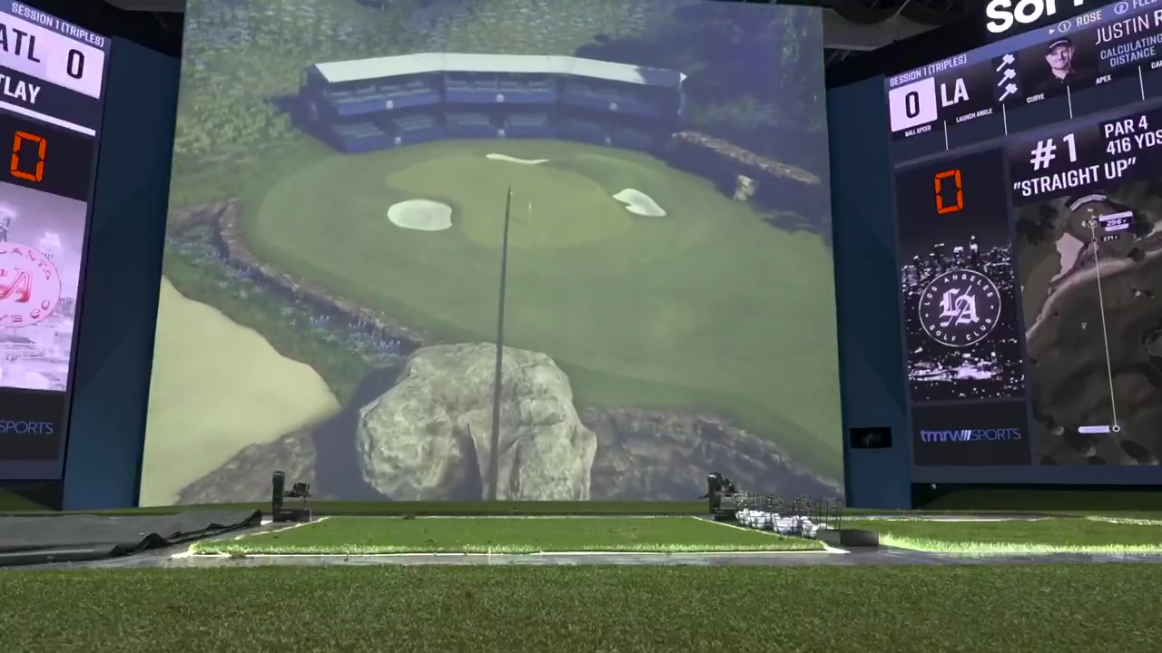 Tommy Fleetwood hitting a hole-in-one on a golf simulator.