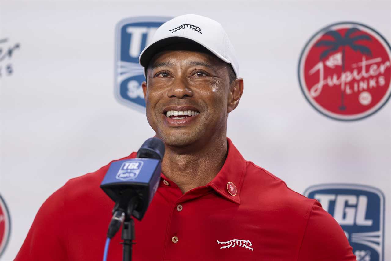 Tiger Woods being interviewed at a golf event.