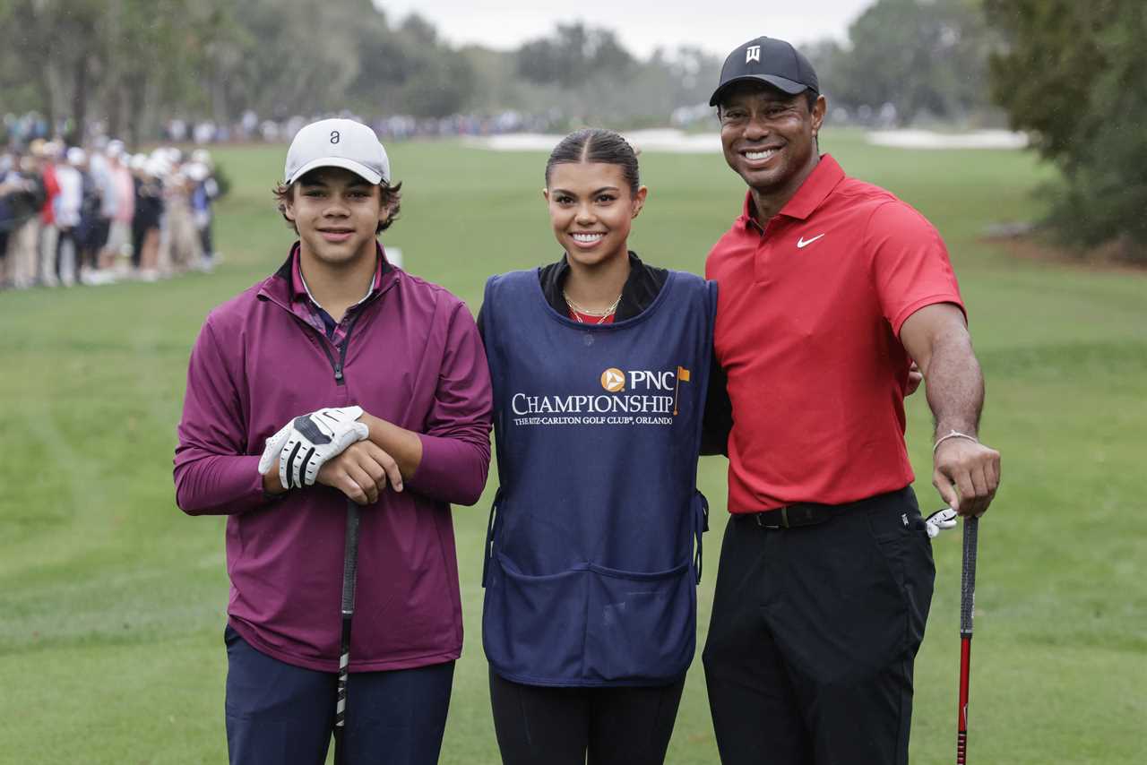 Tiger Woods with his children, Charlie and Sam, at a golf tournament.