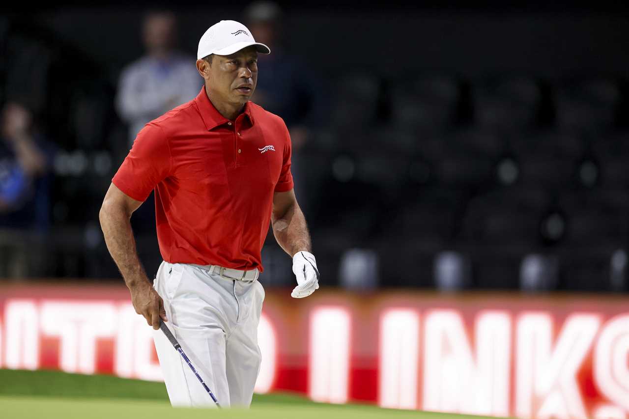 Tiger Woods warming up before a golf match.