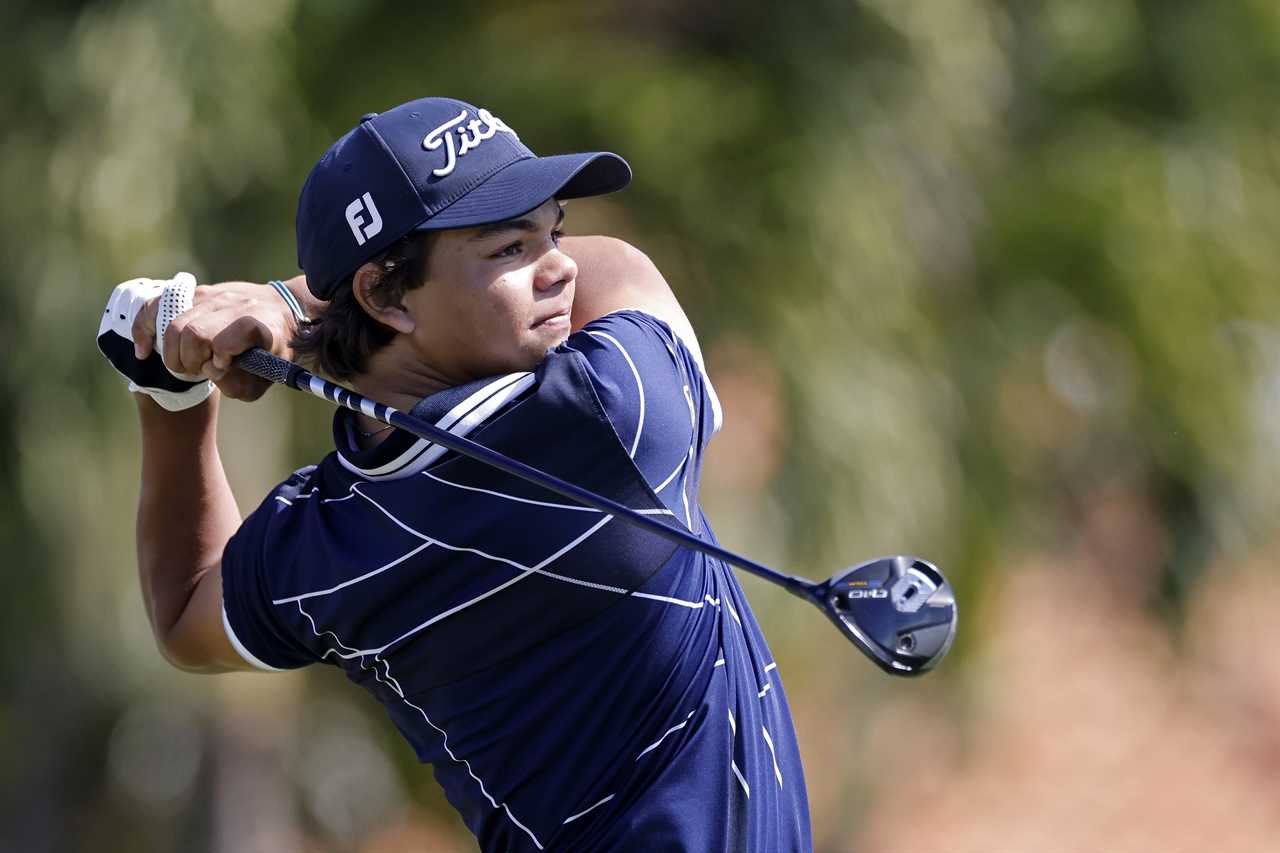 Charlie Woods teeing off at a golf tournament.