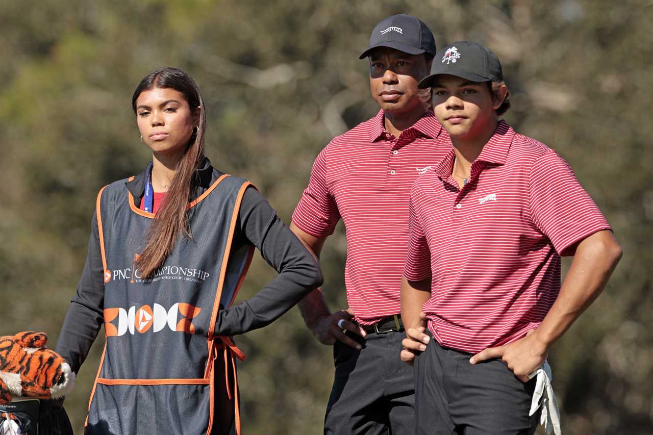 Tiger Woods with his son and daughter at a golf tournament.