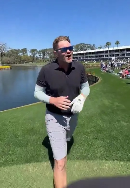 JJ Jakovac, Collin Morikawa's caddie, reacting after making a hole-in-one.