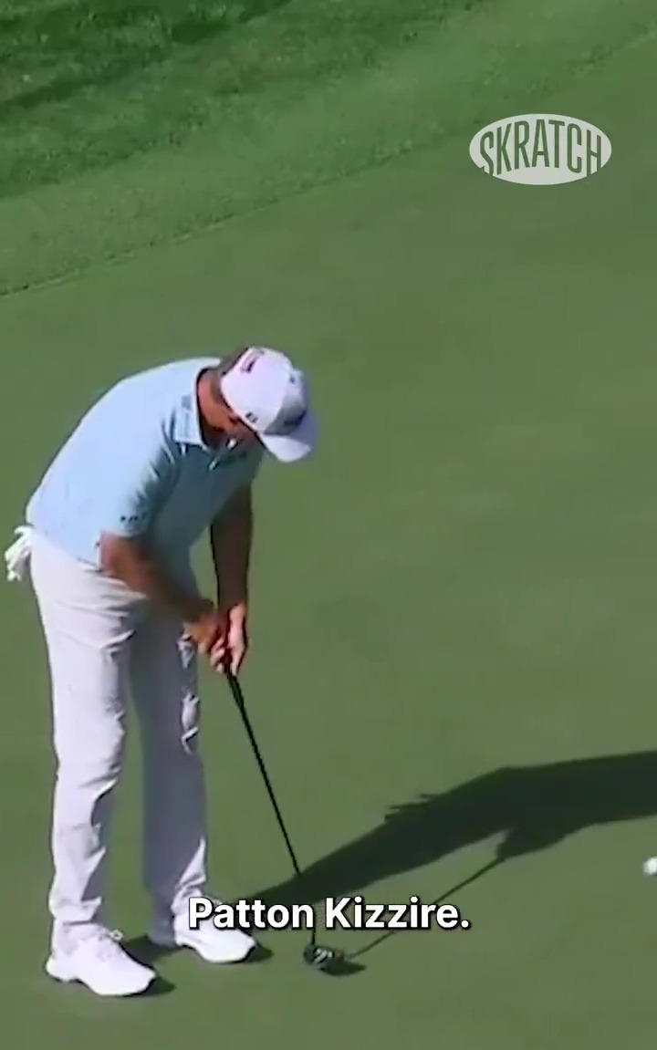 Golfer Patton Kizzire kicks his putter after a missed putt.