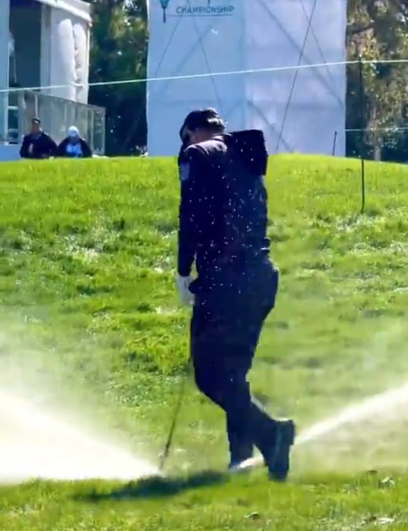 Golfer Adam Hadwin accidentally hits a sprinkler head.