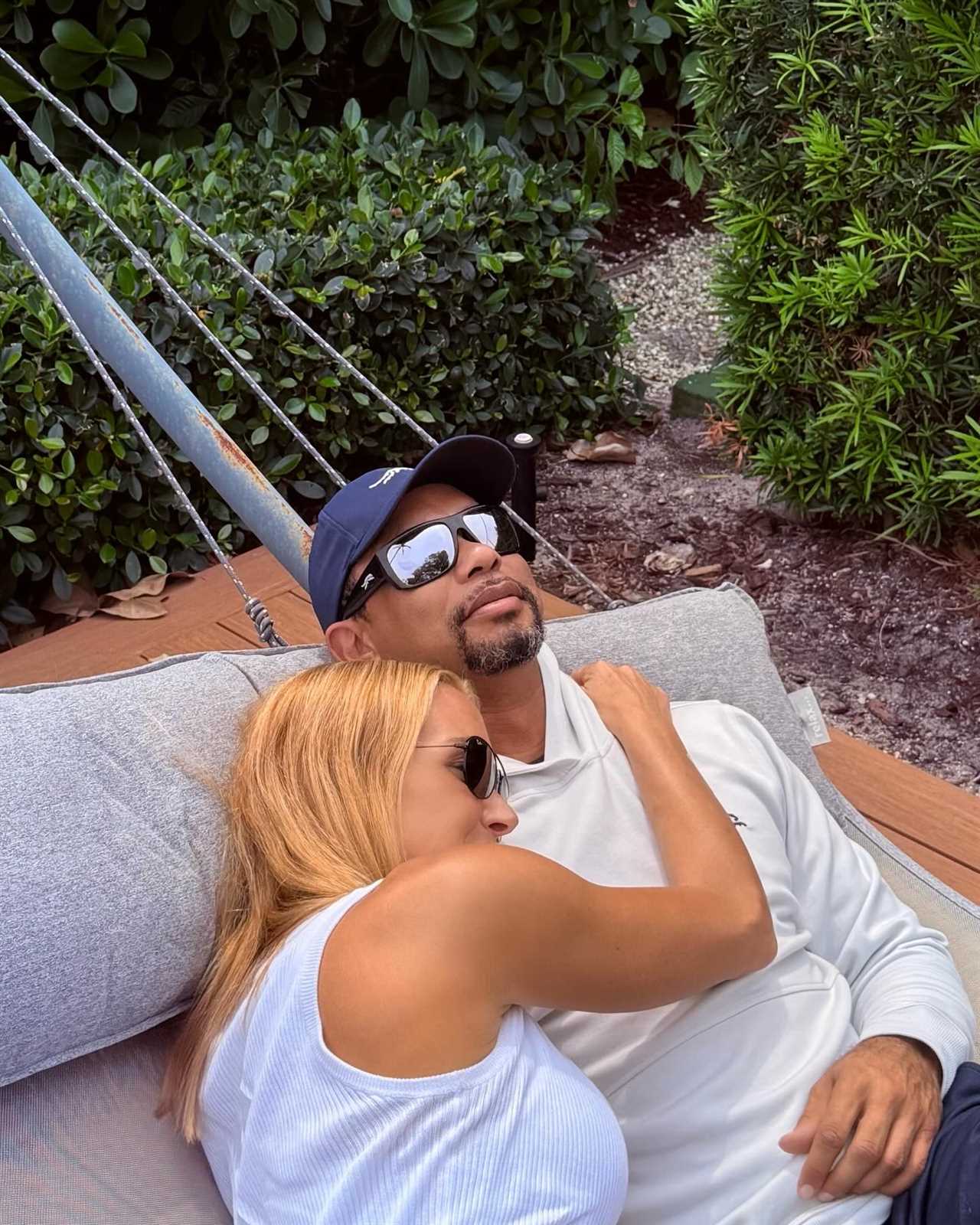 Tiger Woods and Vanessa Trump embracing in a hammock.