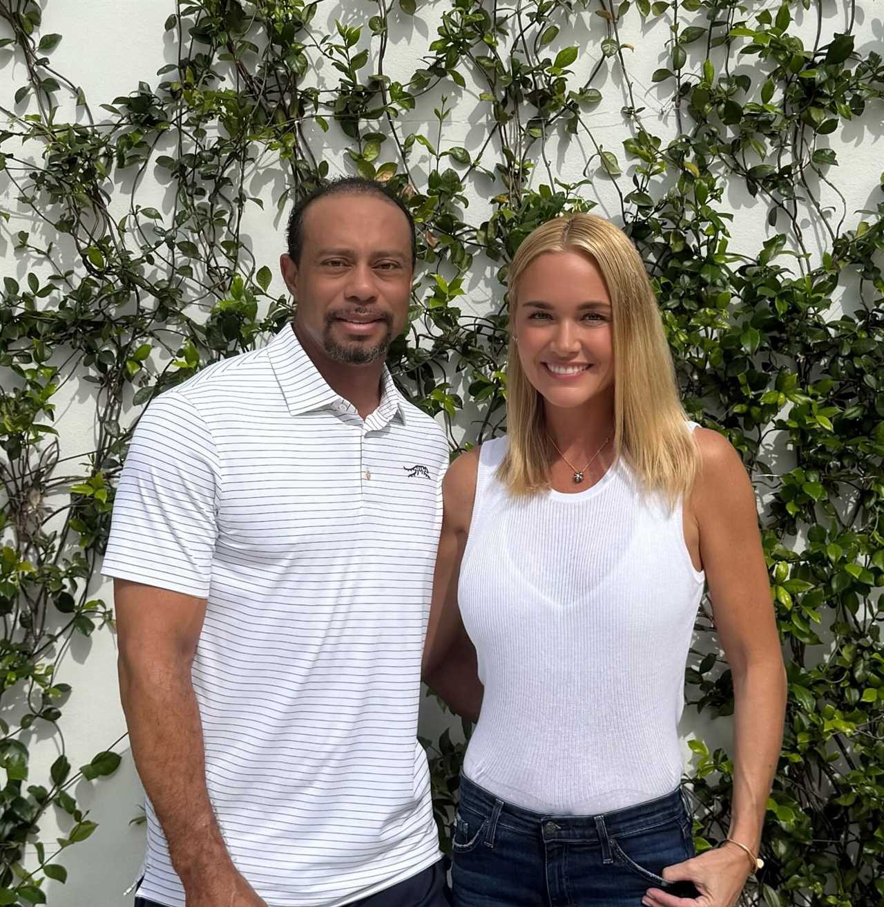 Tiger Woods and Vanessa Trump posing together.