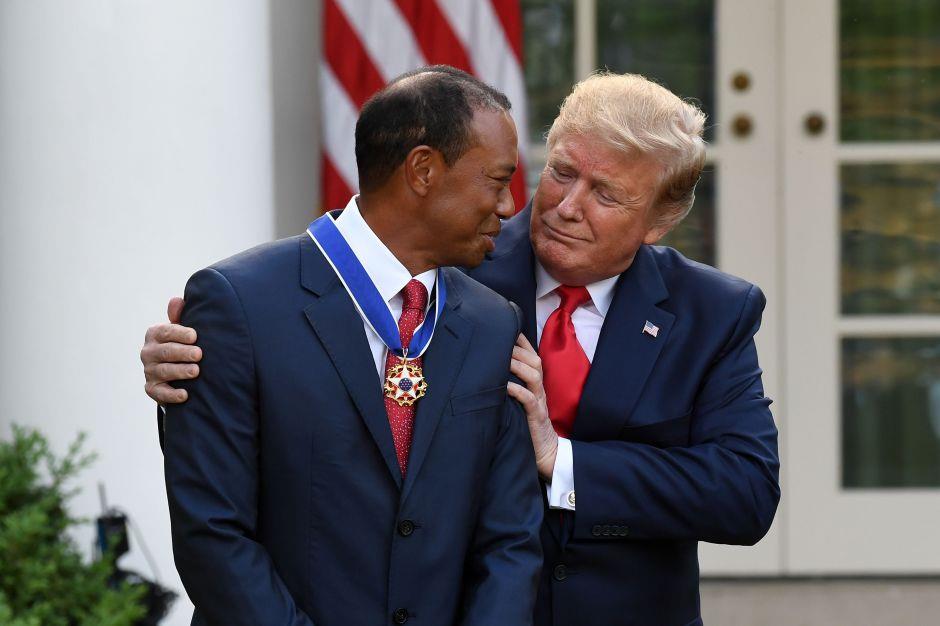 Tiger Woods receiving the Presidential Medal of Freedom from President Trump.