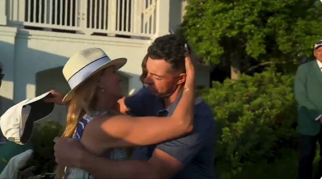 Rory McIlroy embracing Kate Rose.