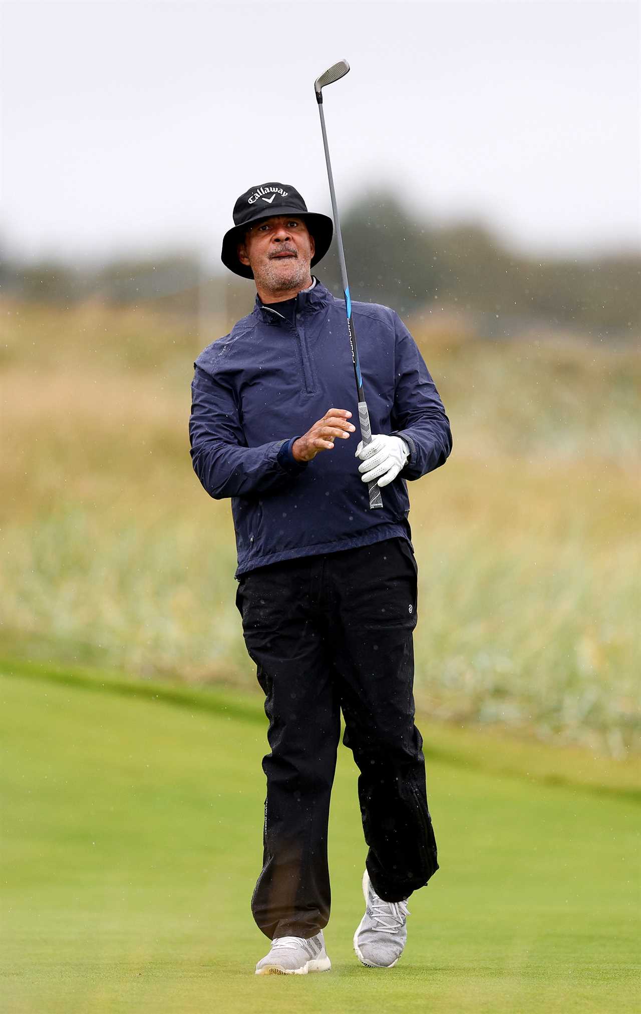 Ruud Gullit playing golf.