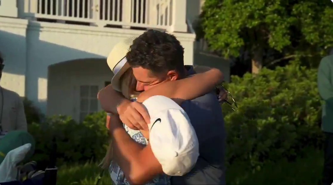 Rory McIlroy hugging Justin Rose's wife.