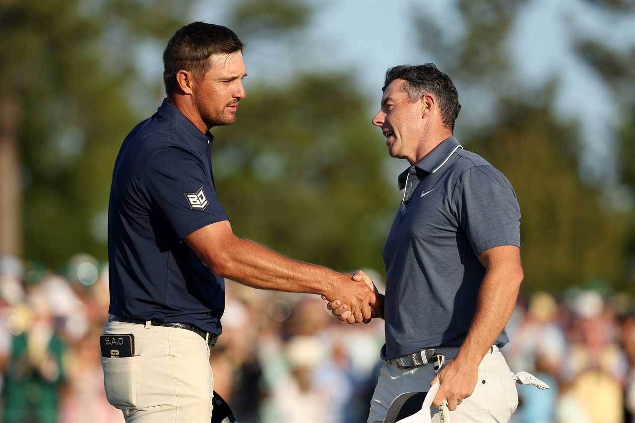 Rory McIlroy and Bryson DeChambeau shaking hands.
