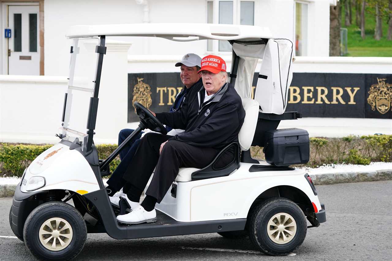 Donald Trump in a golf cart.