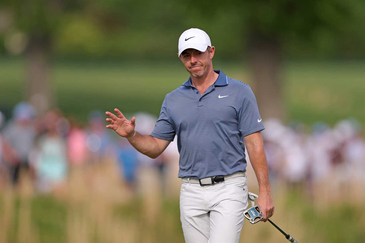 Rory McIlroy acknowledging the crowd during a golf tournament.