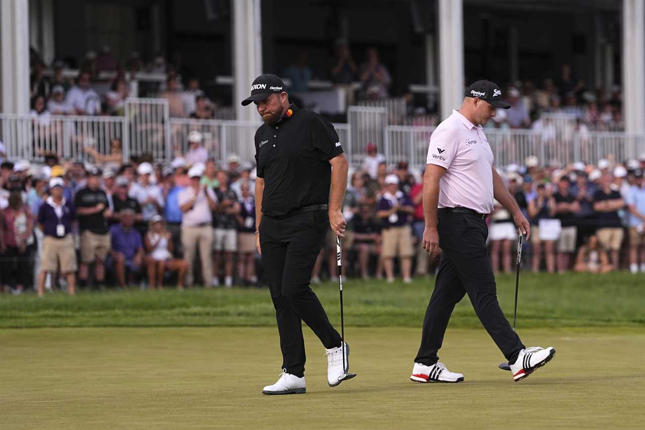 Shane Lowry and Sepp Straka walking on the 18th hole.