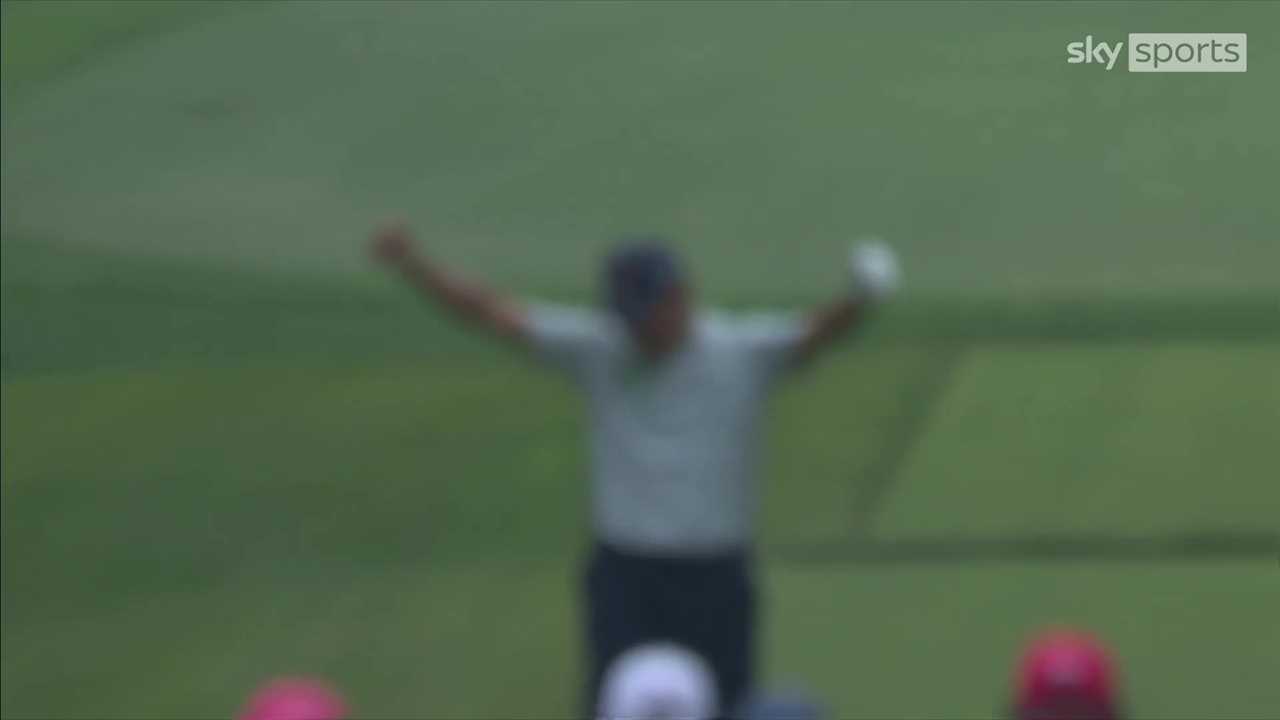 Blurry image of Si Woo Kim celebrating a hole-in-one.
