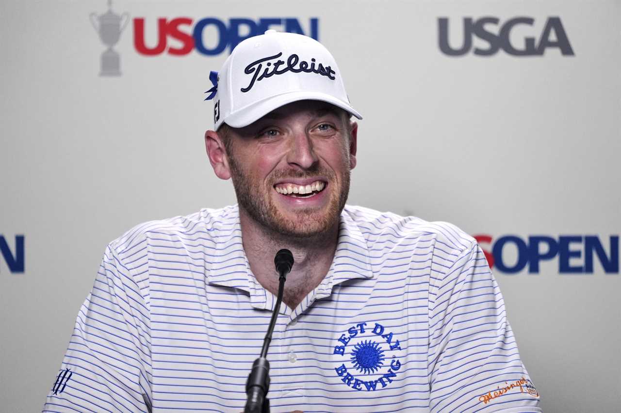 Matt Vogt smiling at a press conference.