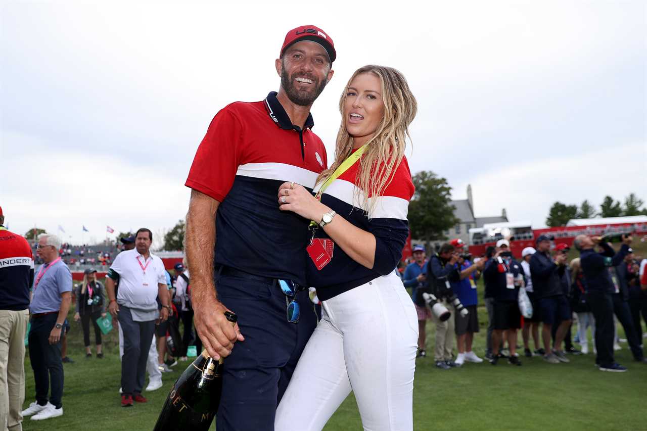 Dustin Johnson and Paulina Gretzky celebrating a Ryder Cup win.