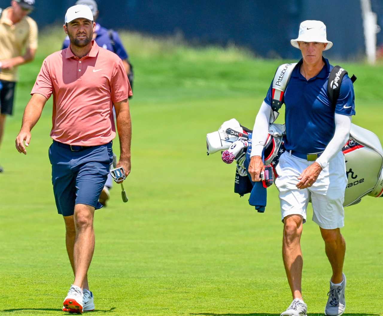 Scottie Scheffler walking on a golf course during a practice round.