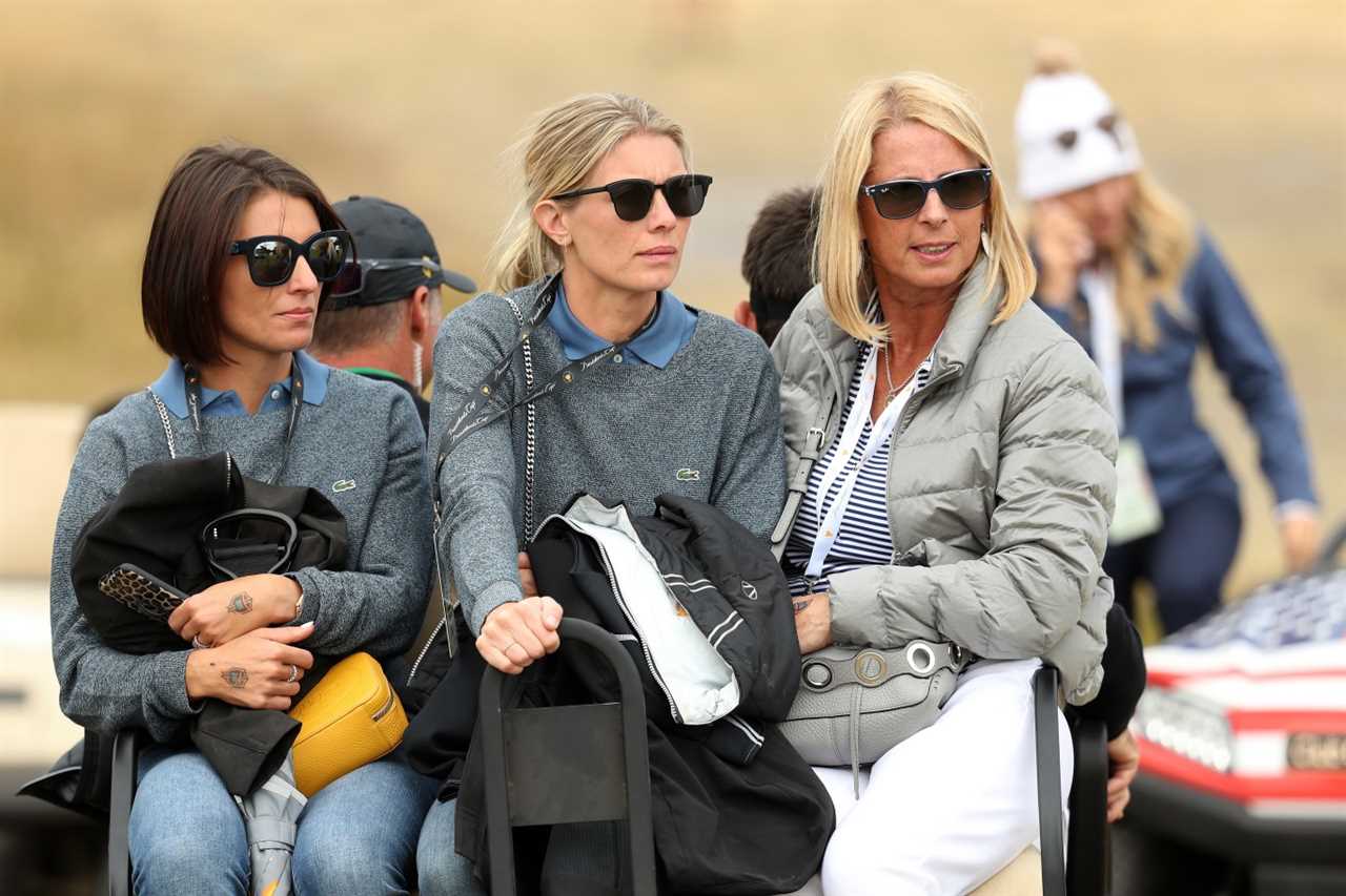 Three women at a golf tournament.