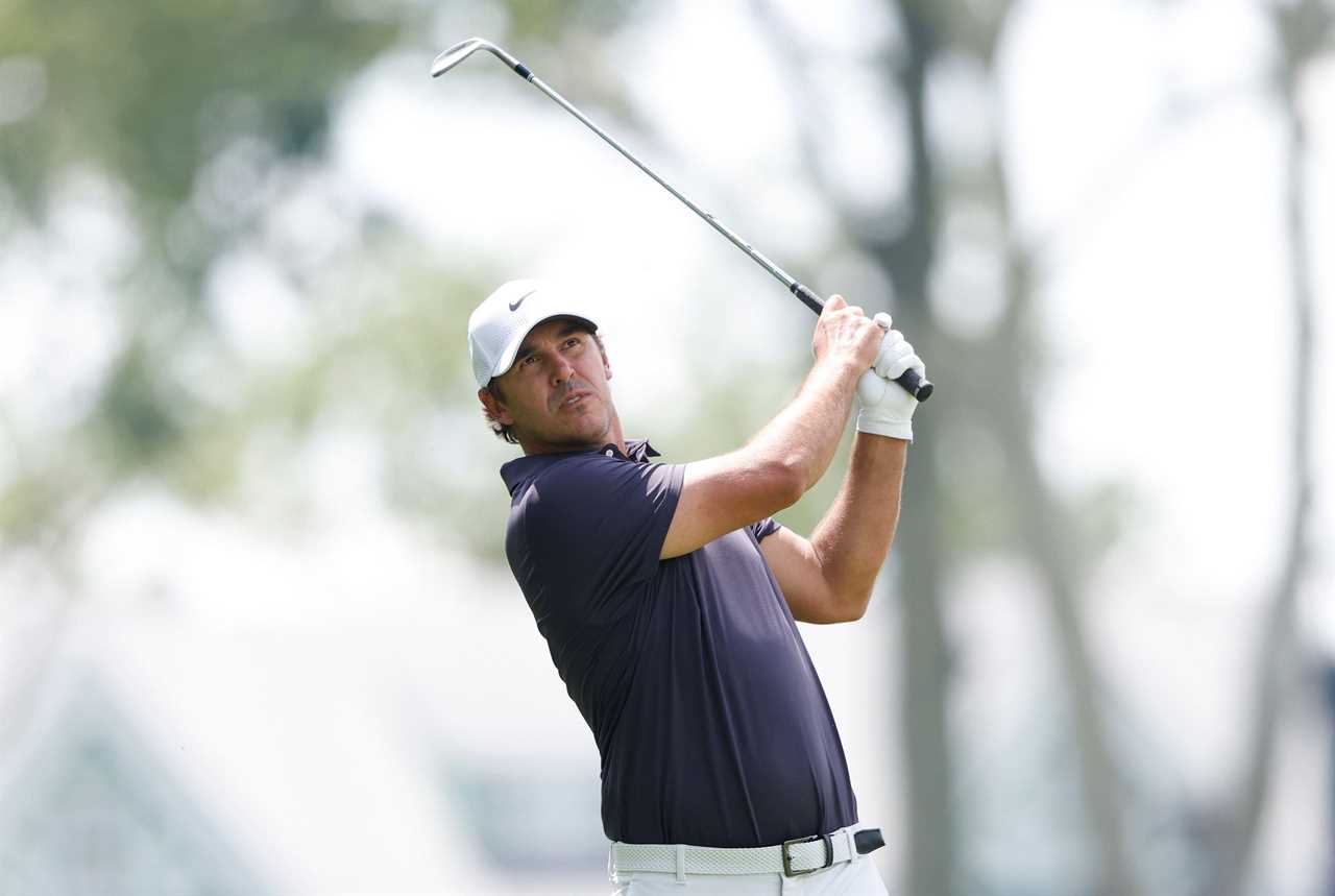 Brooks Koepka hitting a golf shot.