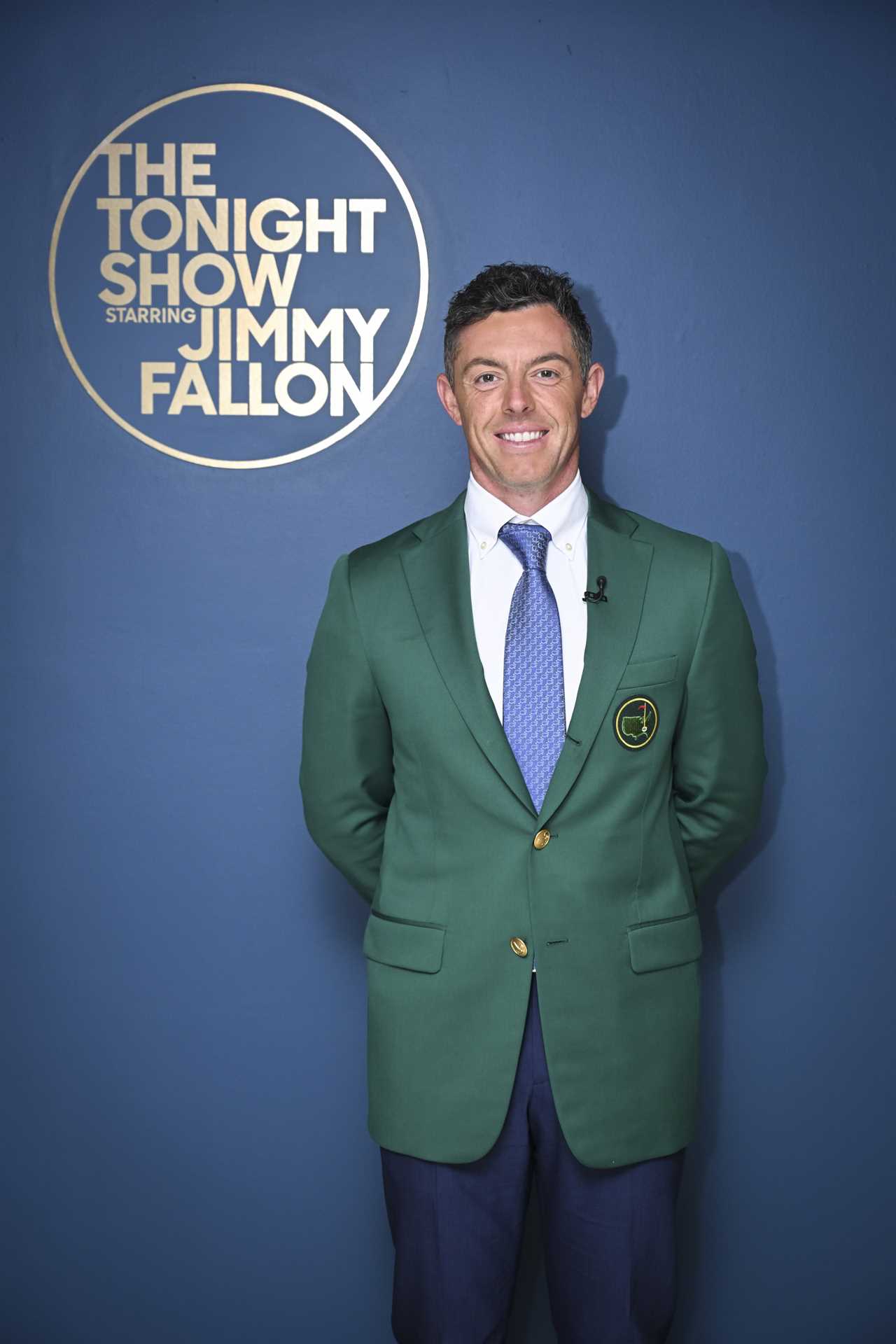 Rory McIlroy in a green jacket backstage at The Tonight Show Starring Jimmy Fallon.