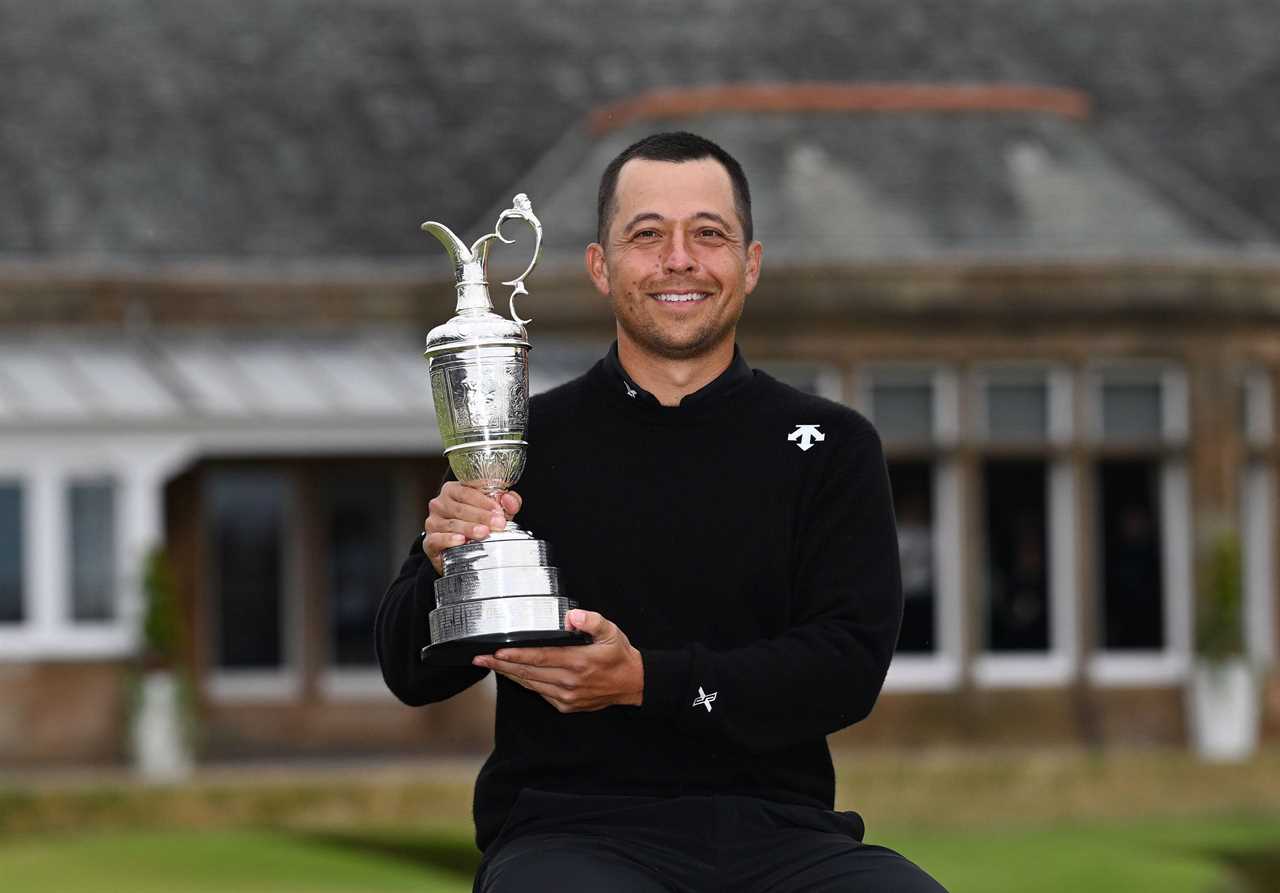 Xander Schauffele holding the Claret Jug after winning the Open Championship.