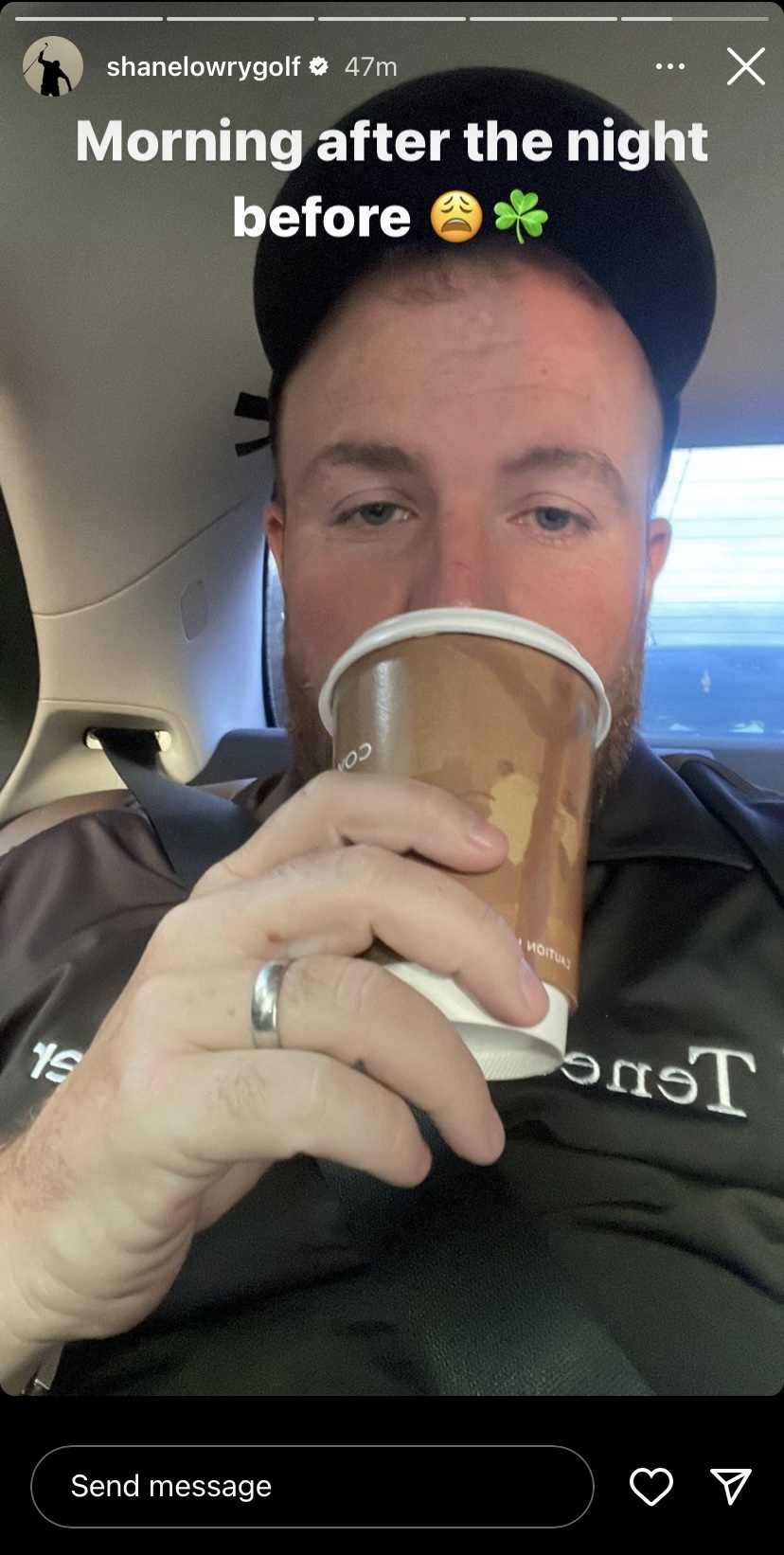 Man drinking coffee in a car.